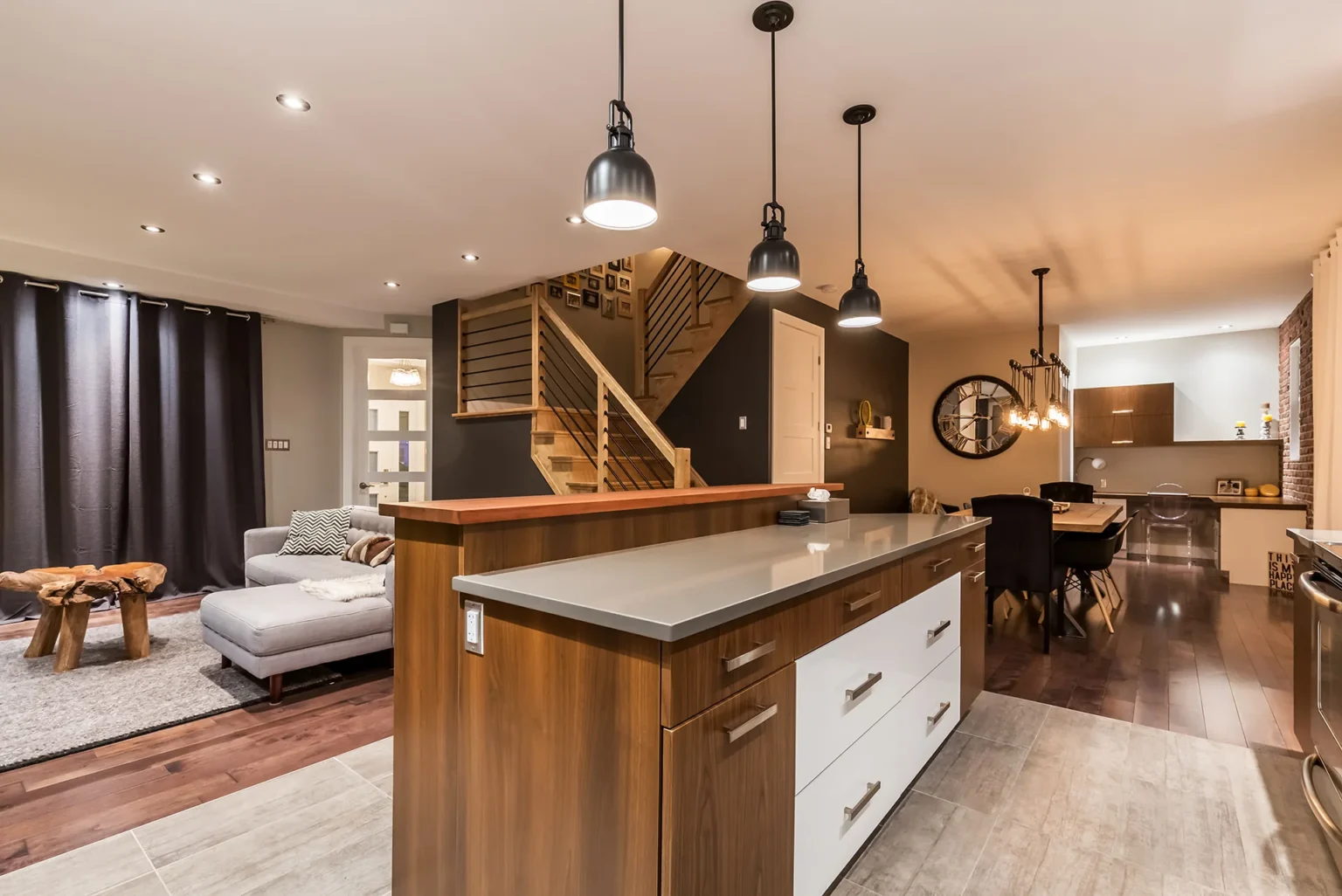Kitchen island with wood accents and pendant lights